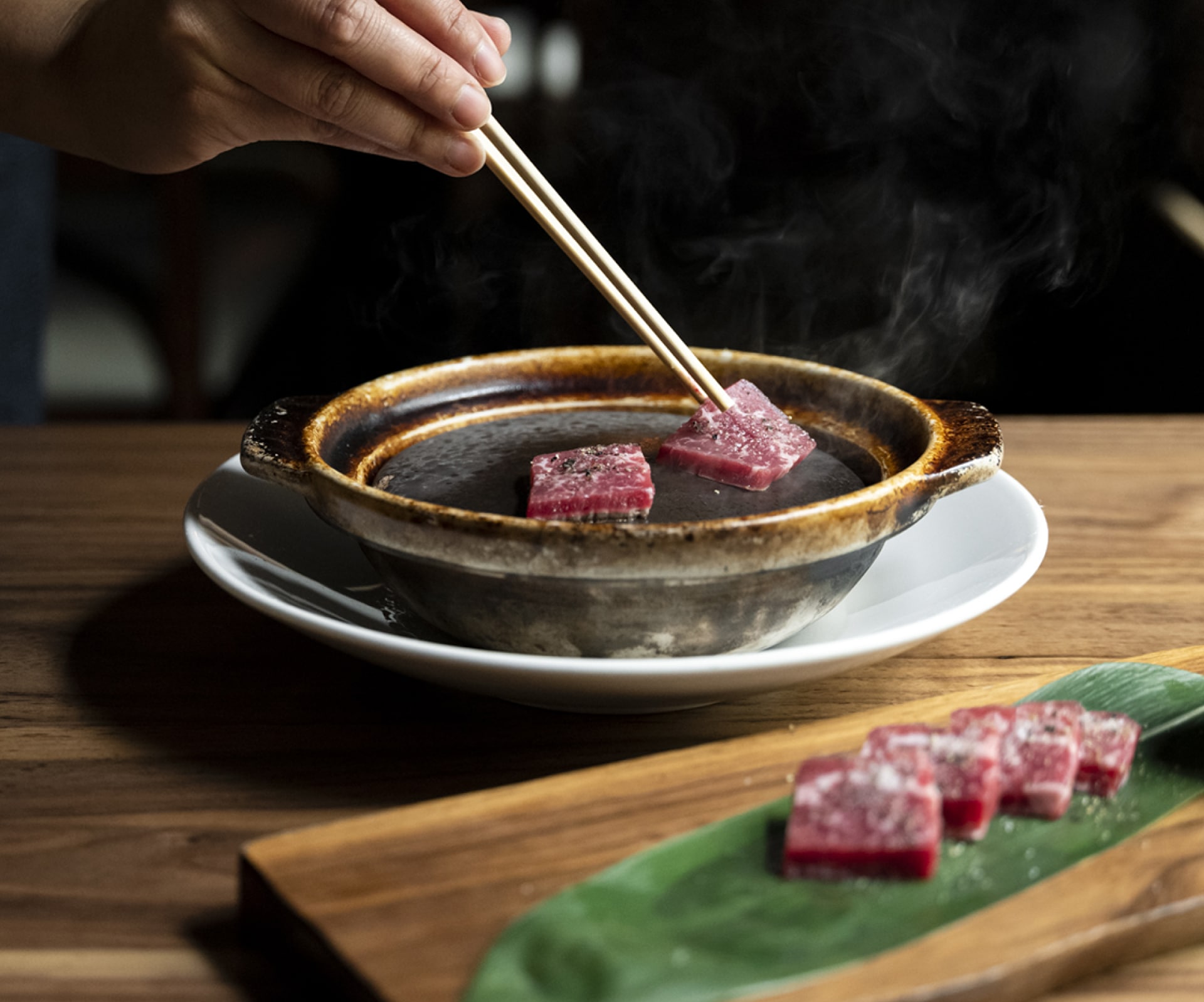 Wagyu Hot Rock served in an earthen bowl.