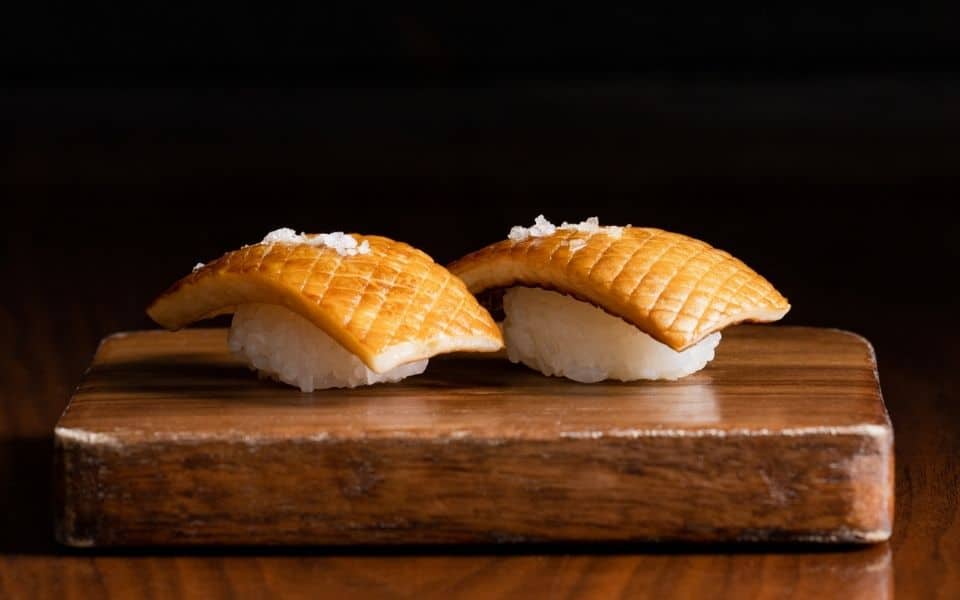 kinoko mushroom nigiri on a wood board