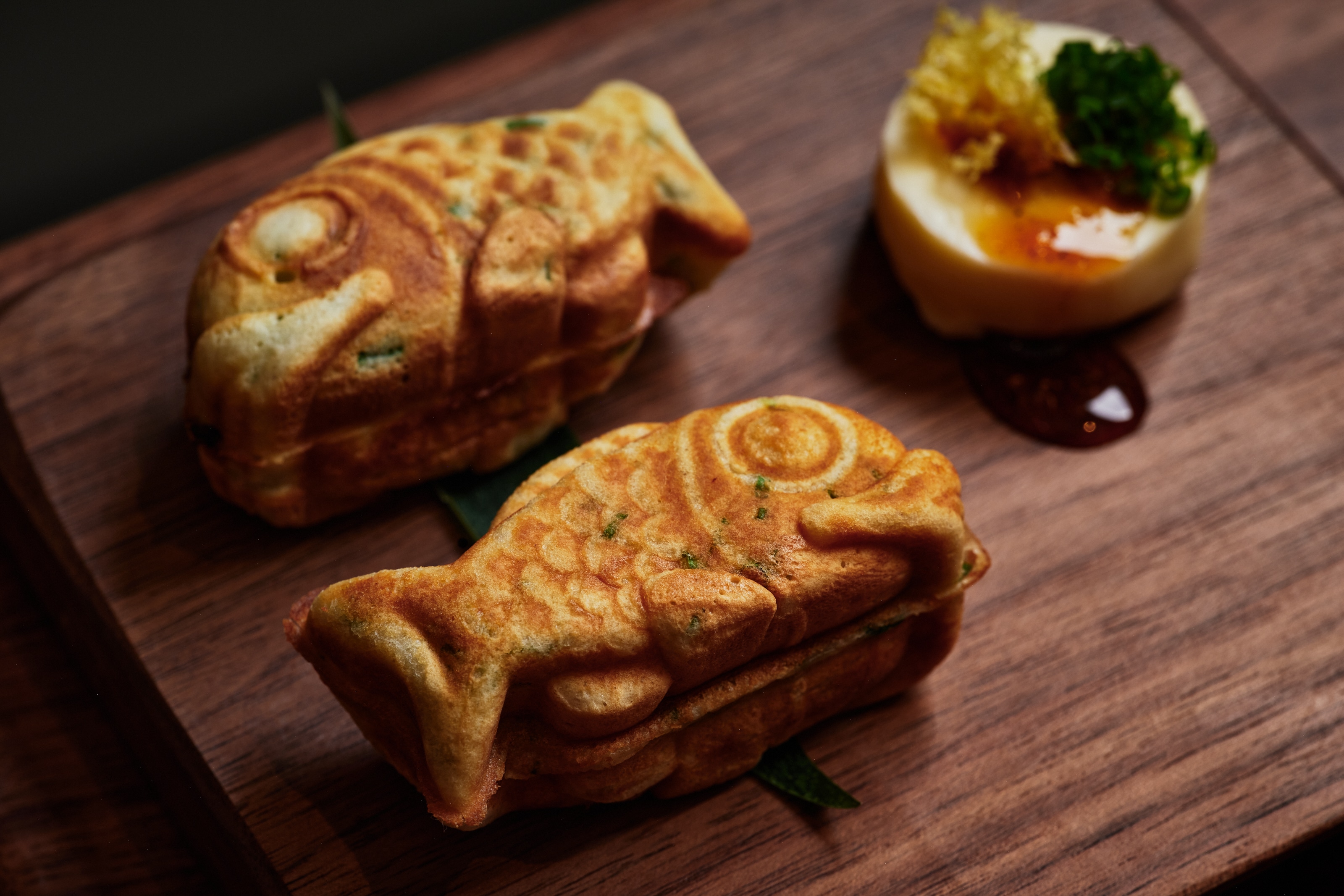 Taiyaki served on a wooden plate.