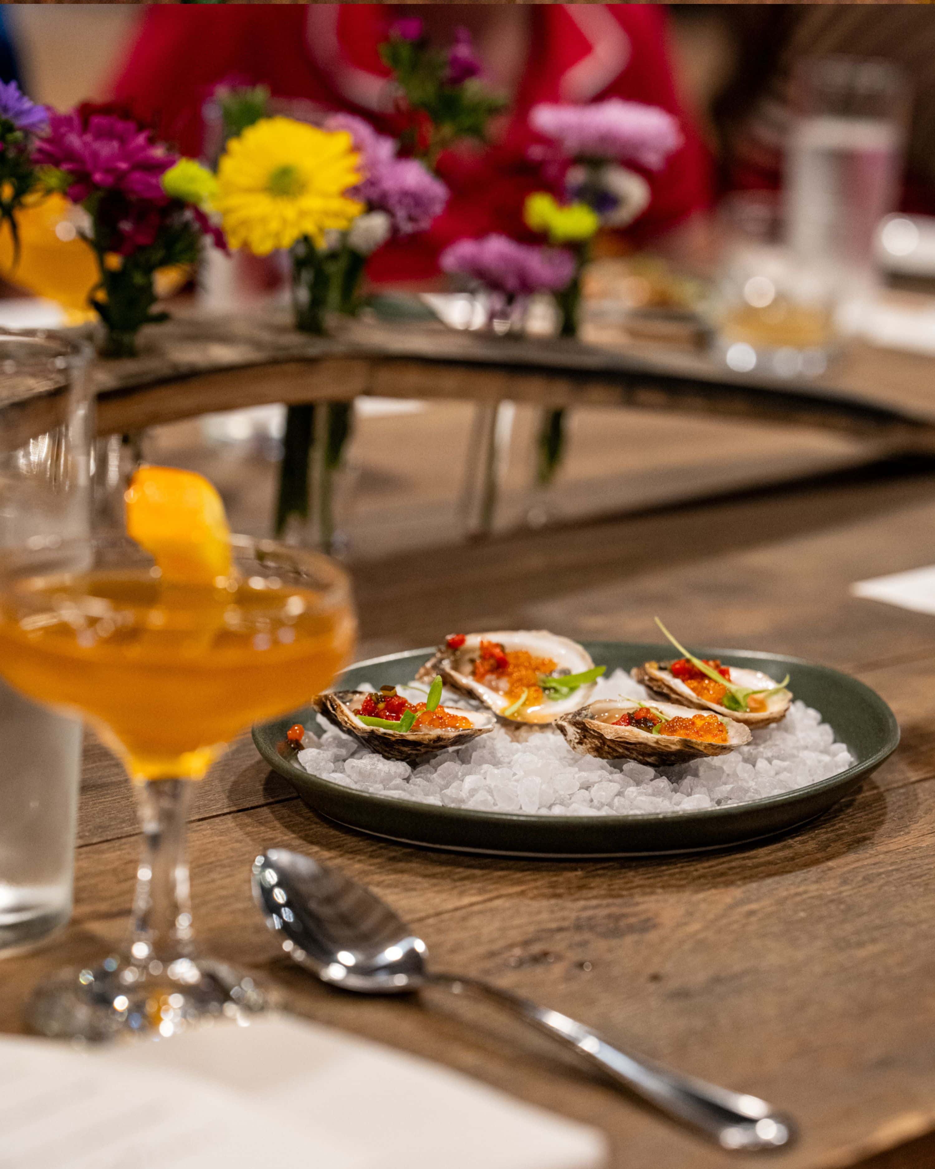 cocktail alongside oyster dish